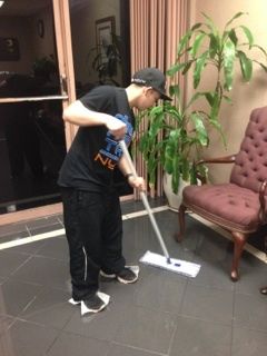 Gold Star Services janitor in Cypress, TX mopping floor.